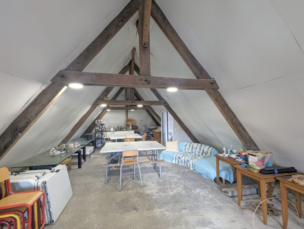 The attic studio under old oak beams