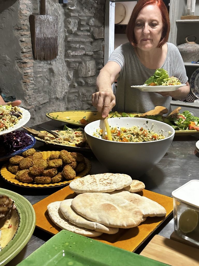 A shared lunch of salads, falafel and flatbreads